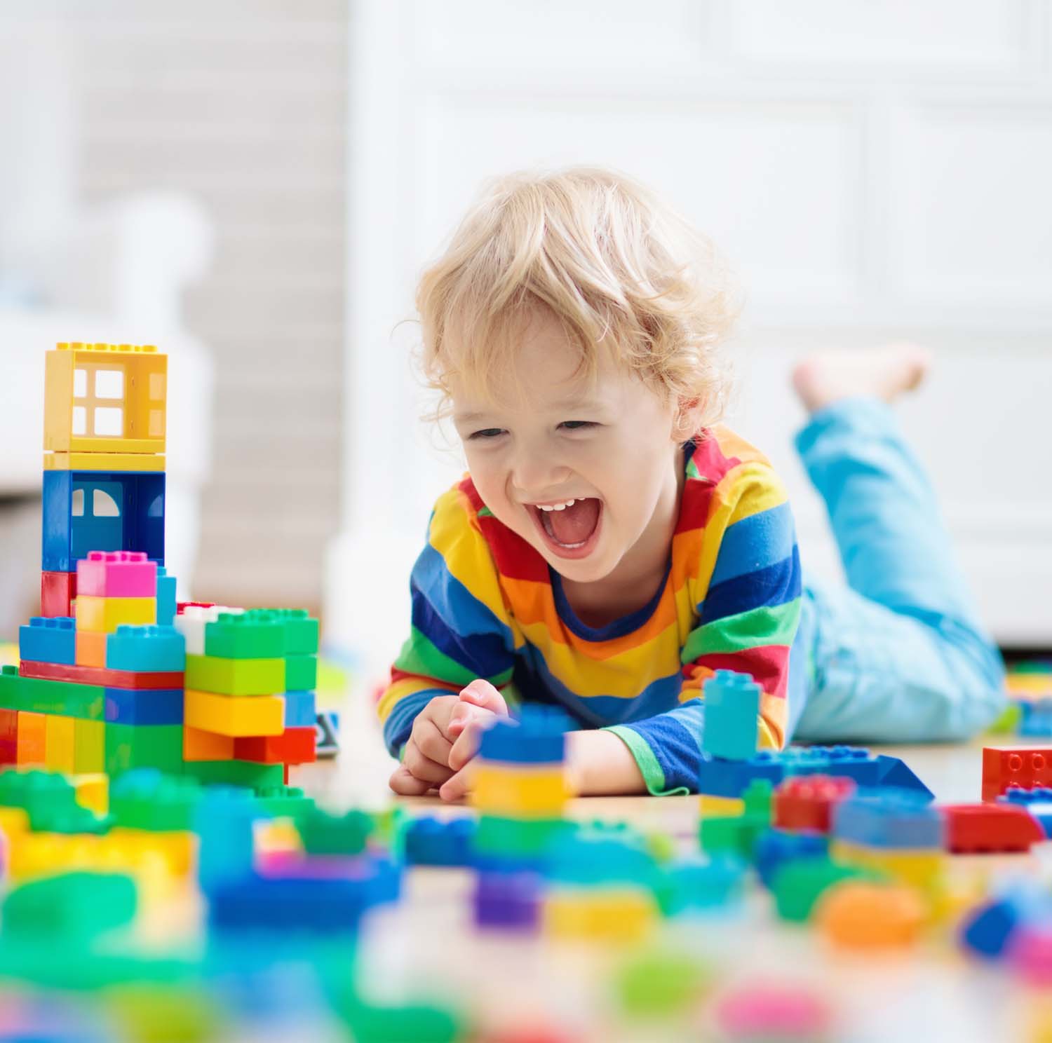 Photo of a Child Playing With Toy Blocks. Toys For Kids.