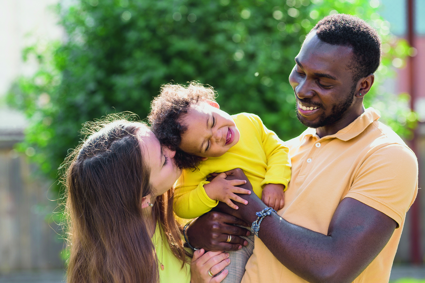 Multiracial mixed family concept. Black father and white mother