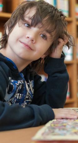 boy scratching head