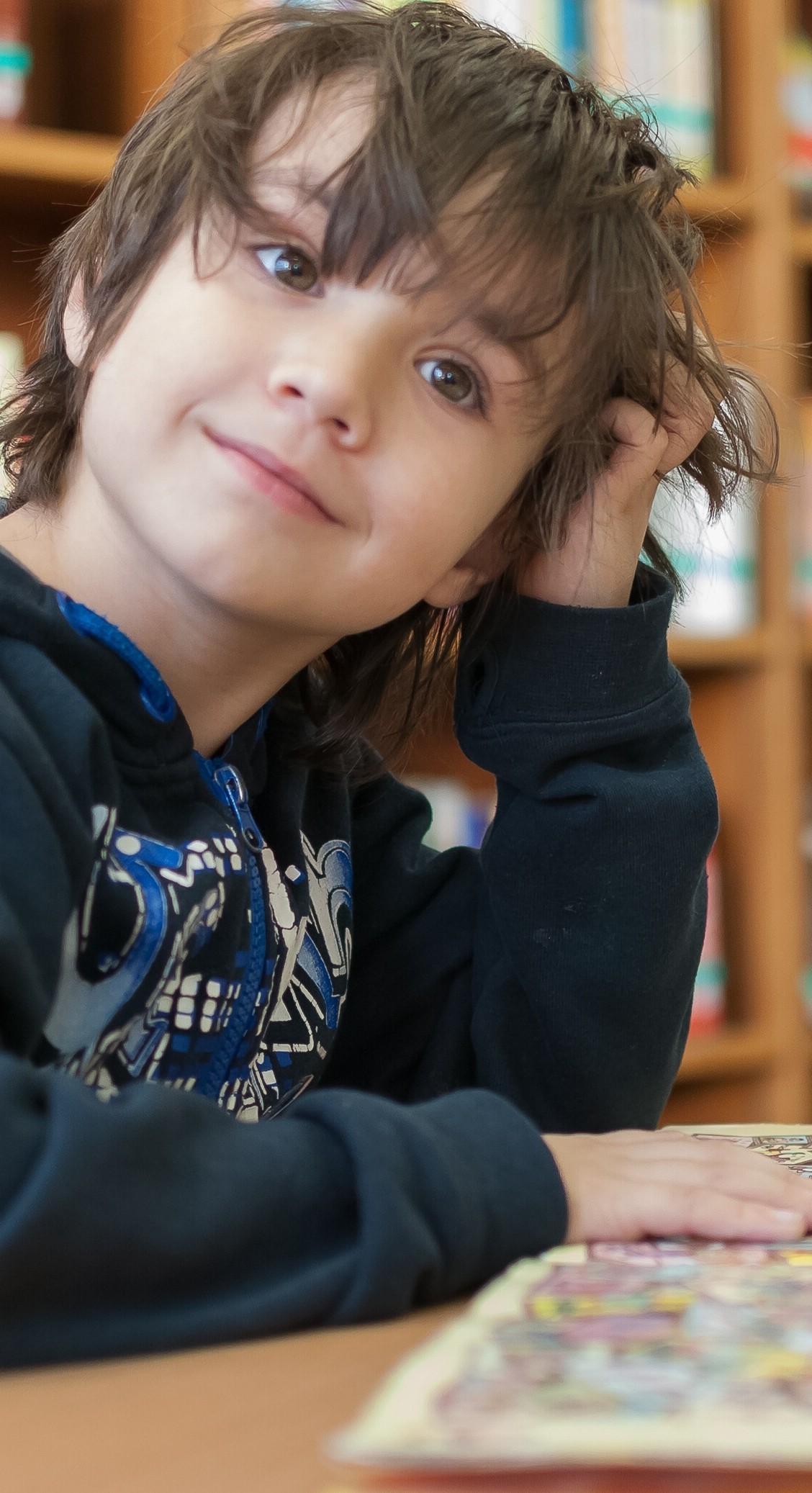 boy scratching head