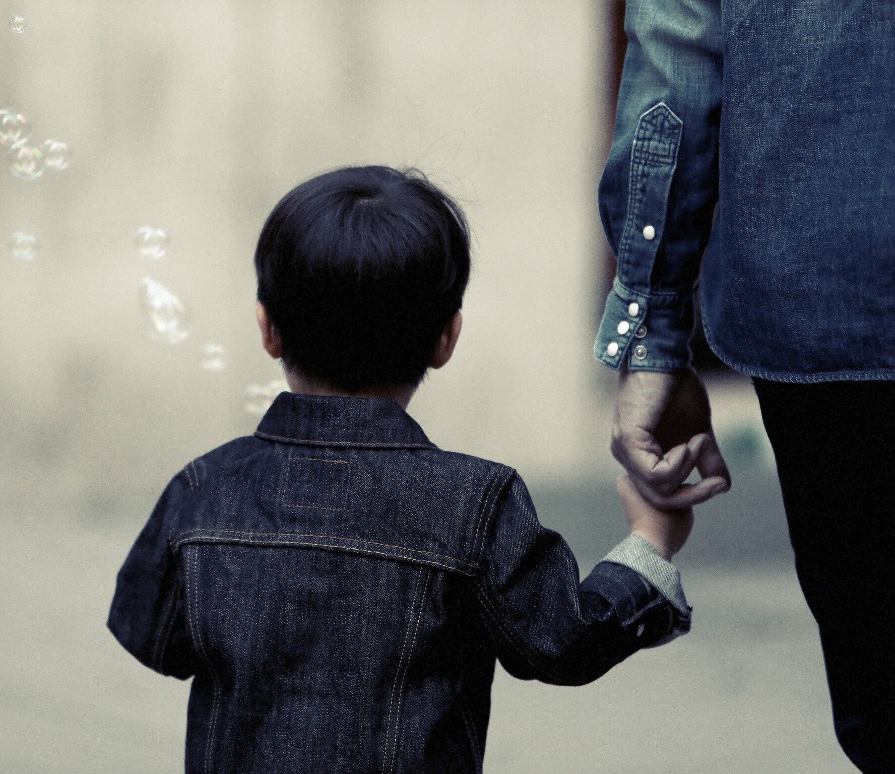 child holding parents hand