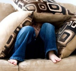 child in cushions