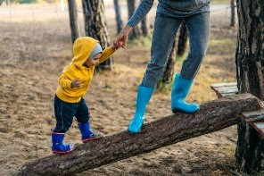 child on log