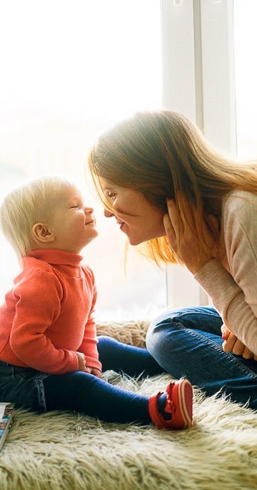 mother and toddler touching noses