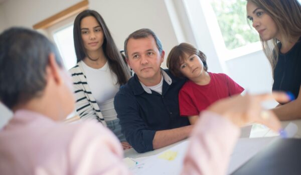 pexels-kampus-8729970 Family having a talk with an advisor