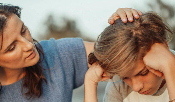 A mum comforting her child