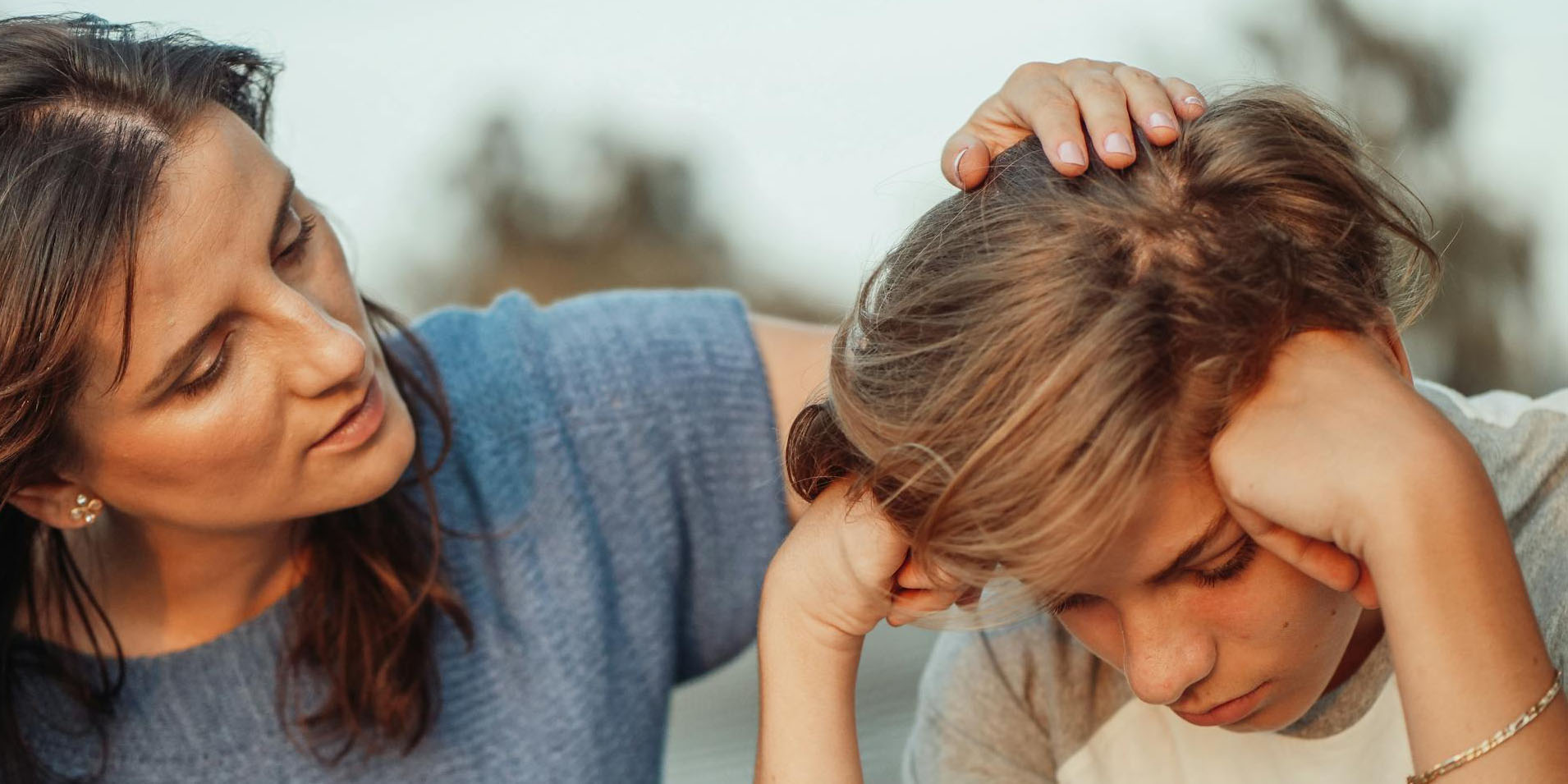 A mum comforting her child